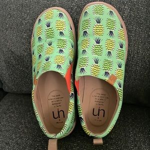 They are like a boat shoe slip on light green with pineapples